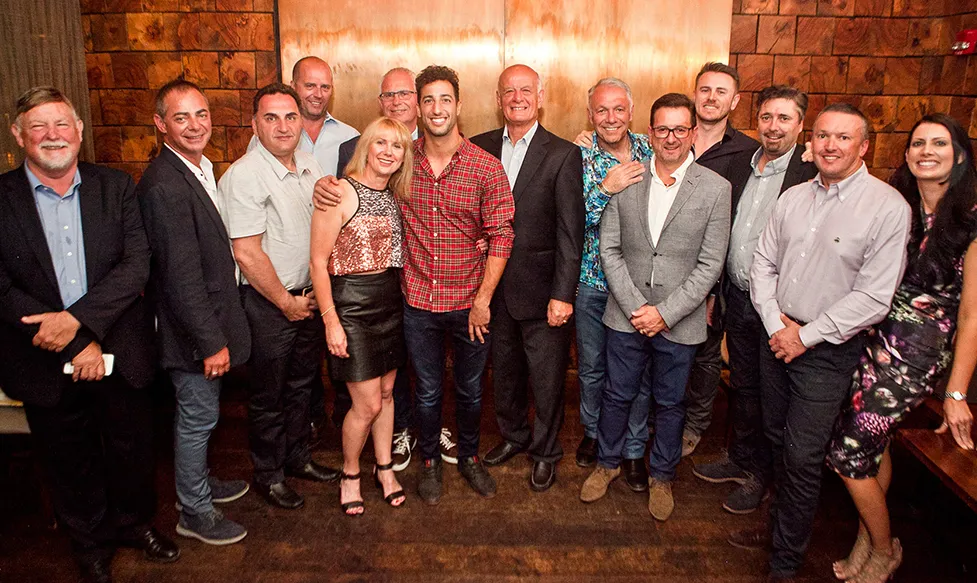 F1 drive Daniel Ricciardo takes a photo with HunterMoss crew and guests in Austin, Texas