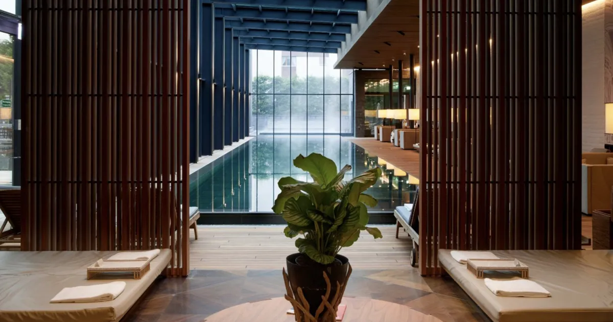 Steam rises from an indoor pool at The Chedi, an HunterMoss partner hotel in Switzerland.