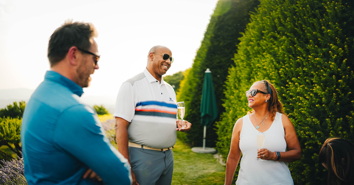 Two HunterMoss guests enjoy a conversation with Anthony Moss in France
