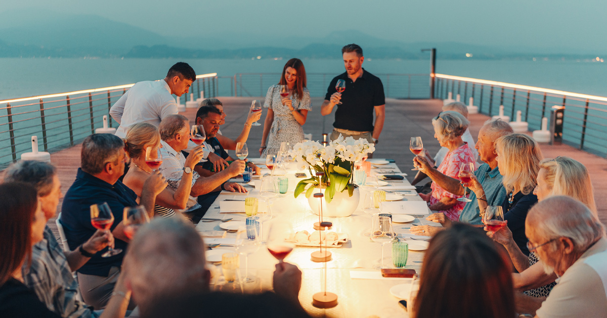 Anthony Moss and Julie Hunter address tour guests at an HunterMoss evening meal on a pier