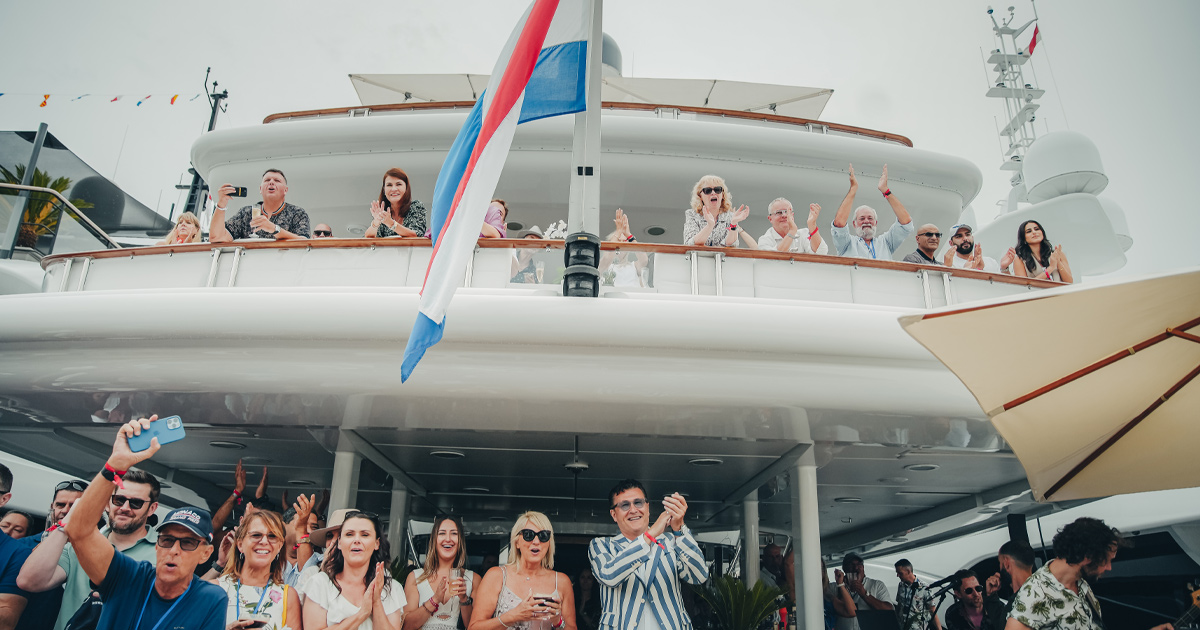 Happy guests cheering on the HunterMoss yacht in Monaco