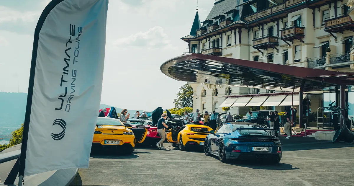 HunterMoss’ fleet of supercars parked outside a luxury hotel.