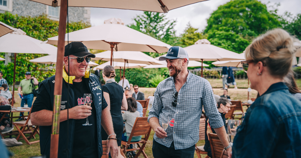 Anthony Moss of HunterMoss shares a laugh with guests at Goodwood