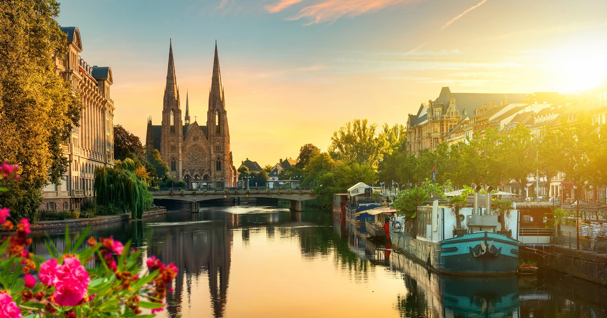 St Paul’s church dominates the skyline above the river Ill, Strasbourg, France