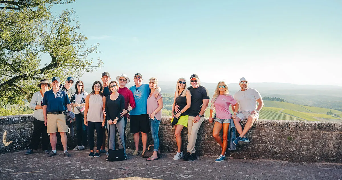 A happy group of HunterMoss guests with scenic backdrop.