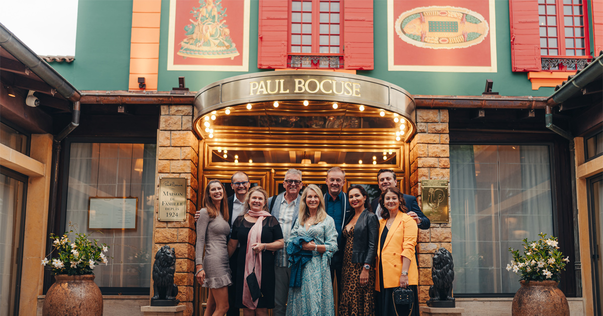 A group of HunterMoss guests at Restaurant Paul Bocuse