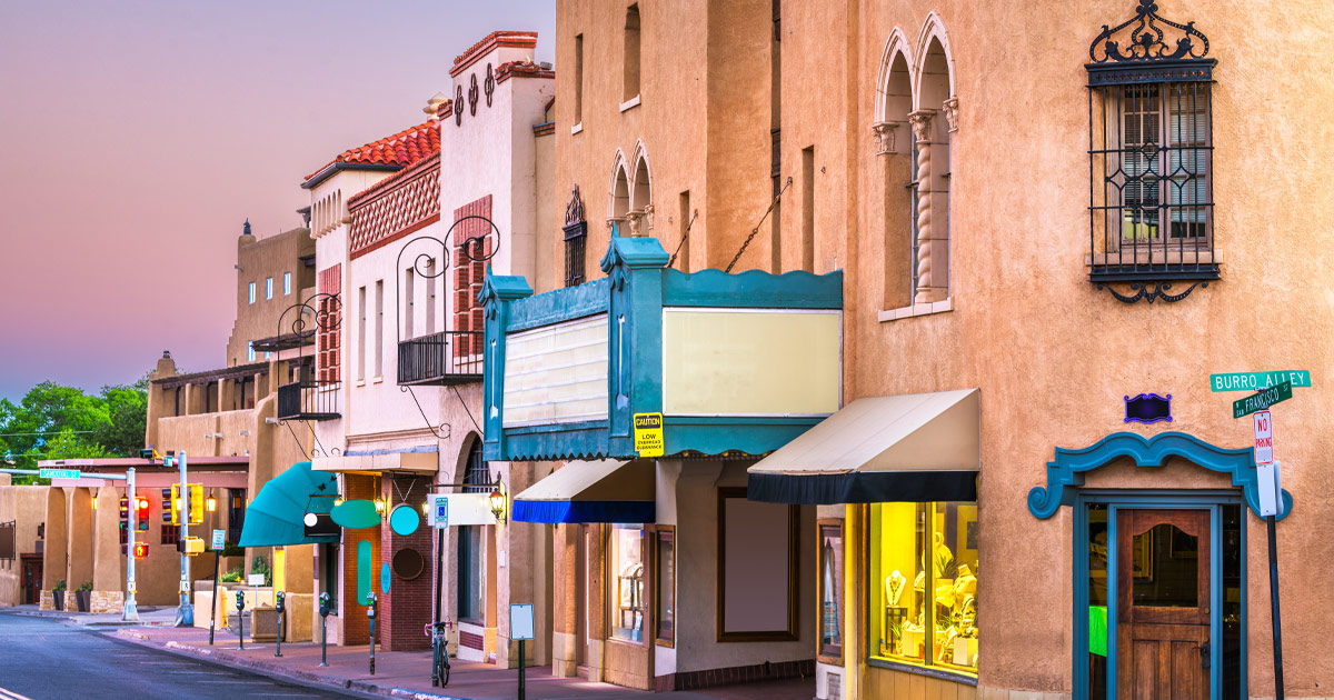 The unmistakable charm of Adobe architecture in Santa Fe. Multicoloured shopfronts and awnings in downtown Santa Fe, New Mexico