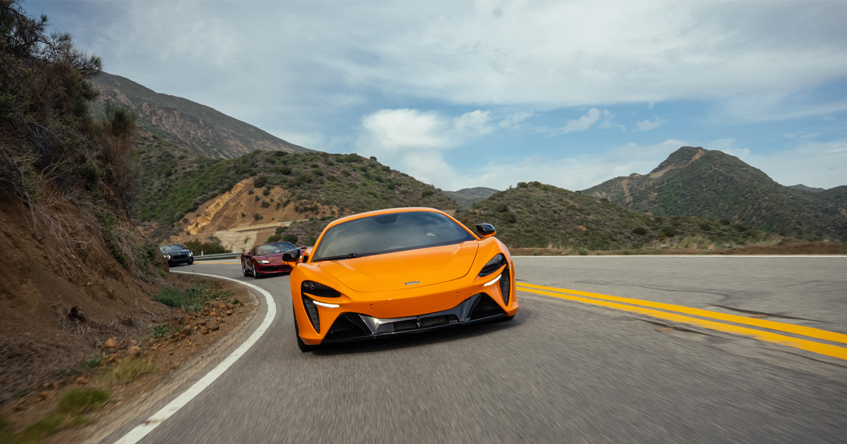 We bring colourful cars to match the vibrant landscapes of New Mexico. An orange McLaren leads a supercar convoy through rugged US countryside on a HunterMoss tour