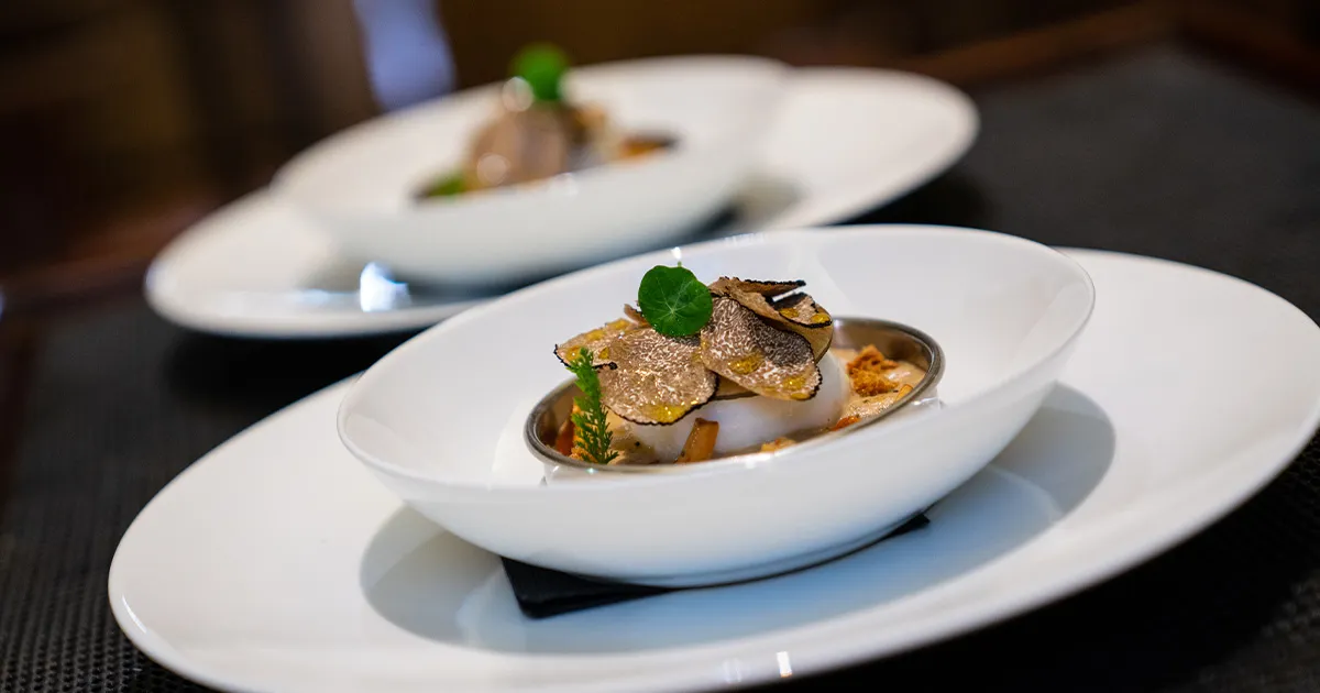 Finely shaved white truffles adorn a delicate meal on an HunterMoss luxury holiday.