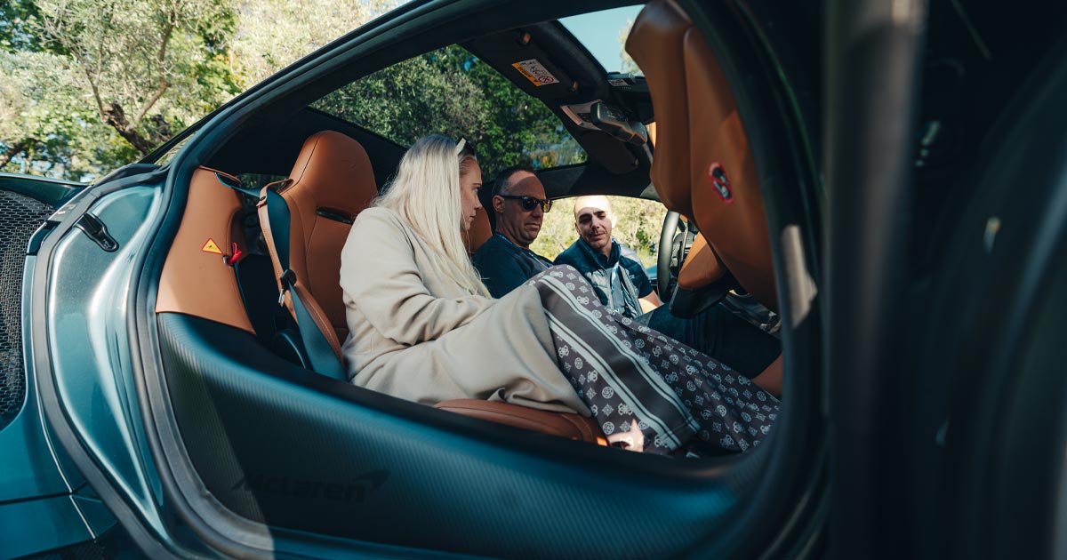 A couple are guided through a vehicle handover as part of an HunterMoss self-drive tour