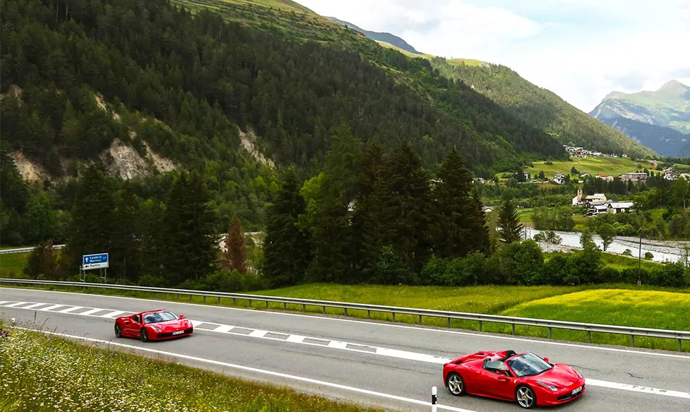 Two red Ferraris stretch their legs in Italy’s rolling hills on an HunterMoss luxury escape