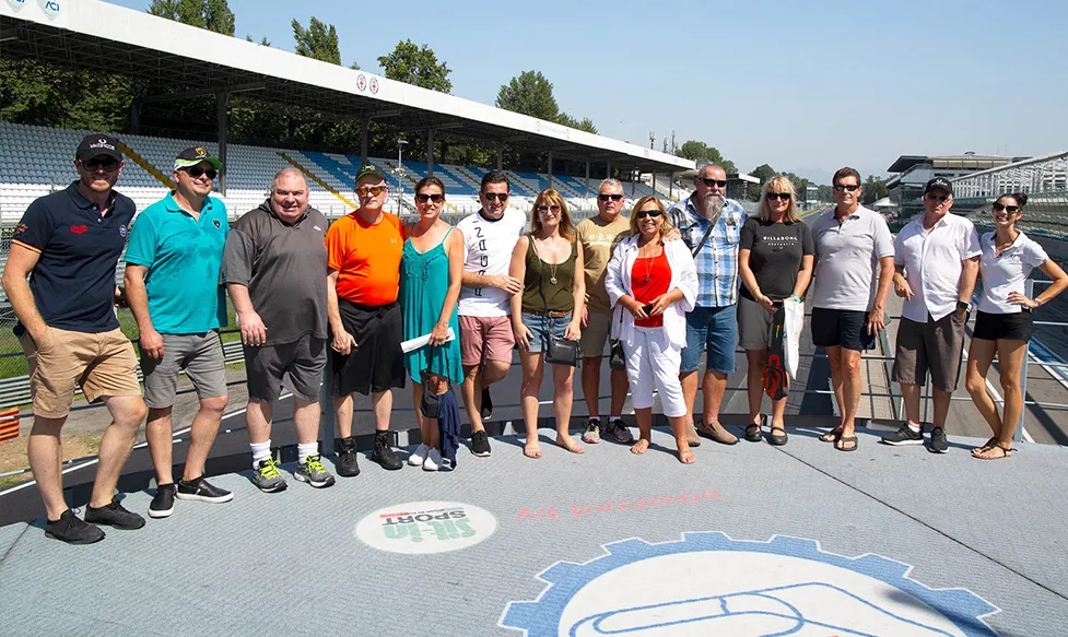 A group of guests on an HunterMoss Italian supercar tour enjoying a tour of the legendary Monza racetrack