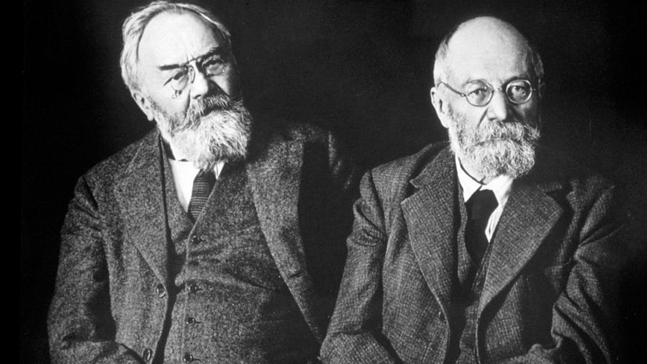 The Michelin brothers, André and Édouard. black and white image of two men with beards and glasses in suits, the michelin brothers André and Édouard