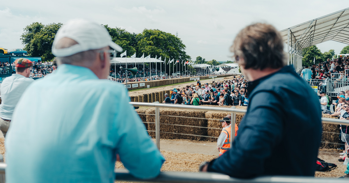 Spectators enjoy prime views of the racing action at Goodwood