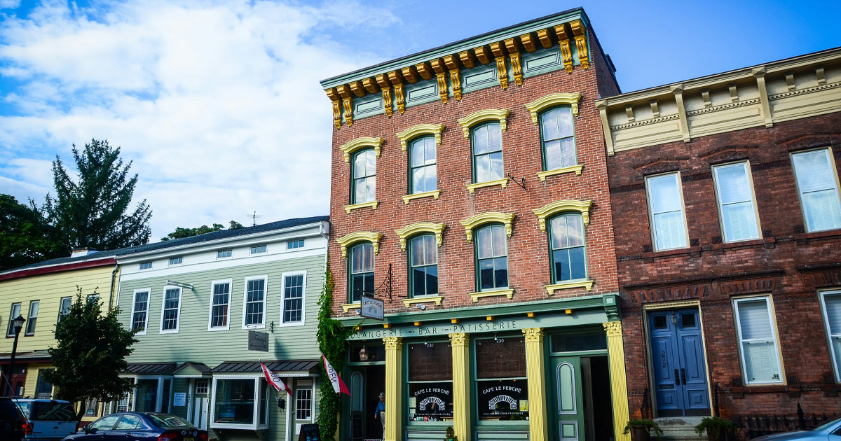 Old-world architecture in Upstate New York: weatherboard buildings, red bricks and elaborate windows