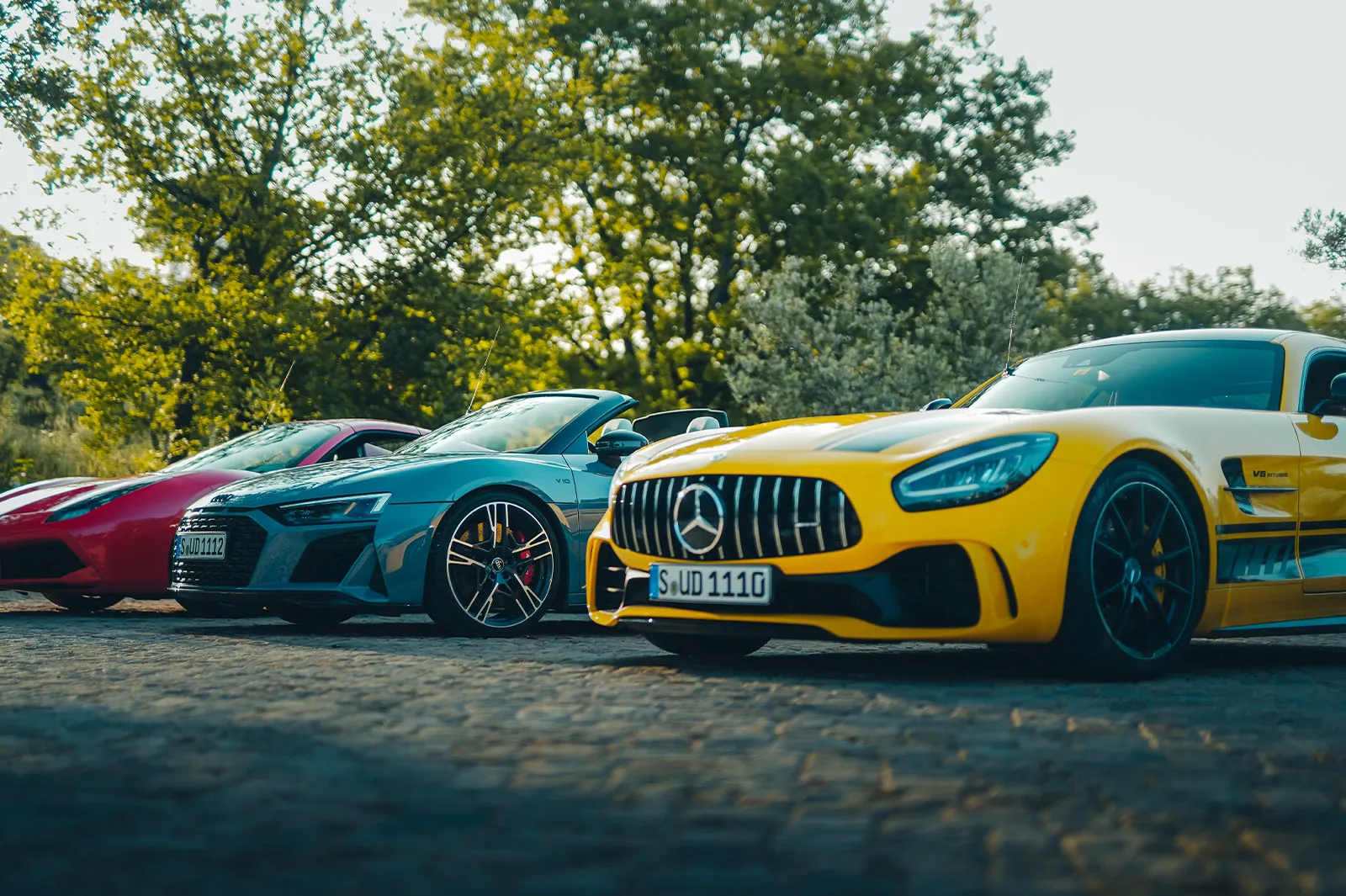A trio of supercars in red, yellow and blue awaiting HunterMoss’ guests
