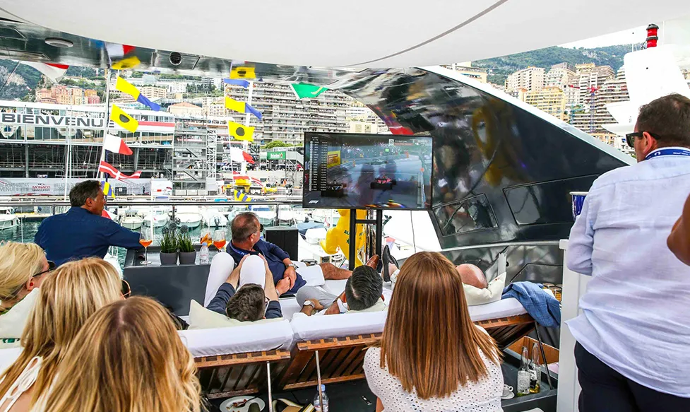 Guests relaxing aboard HunterMoss’ private superyacht at the Monaco Grand Prix