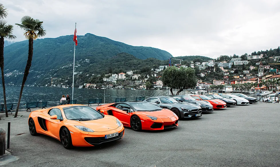 HunterMoss’ fleet of supercars sitting by the waterfront in Switzerland