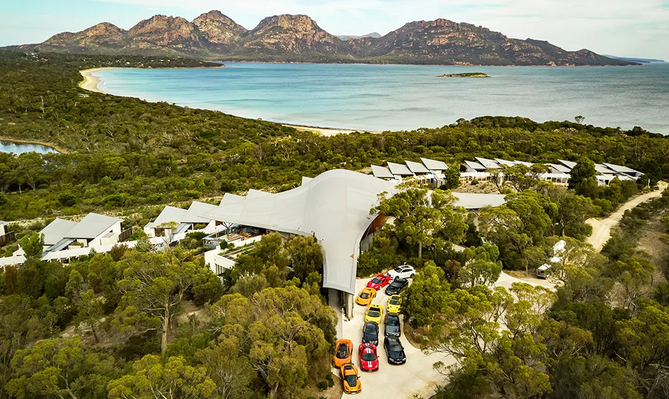 An aerial view of the HunterMoss fleet of supercars at a stunning coastal resort in Australia