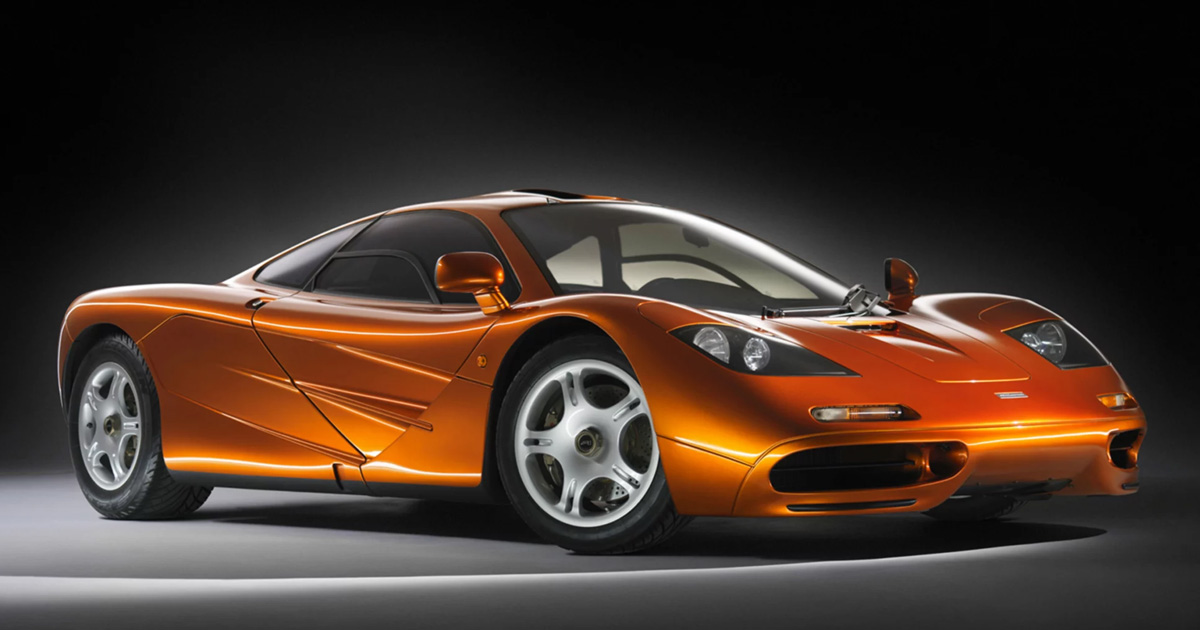 The underside of the engine cover of the F1 was layered with real gold, the finest heat reflector. A metallic orange McLaren F1 in a studio with subtle lighting