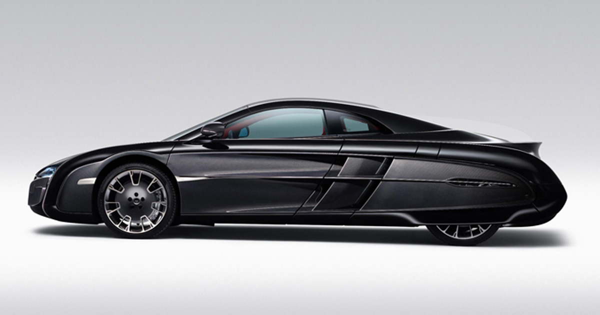 The unique X-1 blended throwback and futuristic design elements. A McLaren X-1 supercar in black with quirky styling including louvred side grates and covered rear wheel